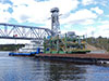 Баржа "Сильвер-3005" с буксиром и "Богатырь" у разведённого Подпорожского моста через реку Свирь