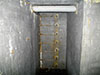 Лестница в шахту наблюдательного бронеколпака внутри ДОТа линии "Салпа"