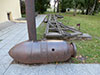 Артиллерийский снаряд и чугунный колесопровод Александровского завода